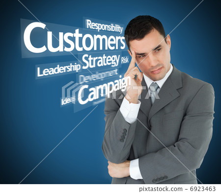 Thoughtful businessman in grey suit Thoughtful businessman in grey suit 6923463