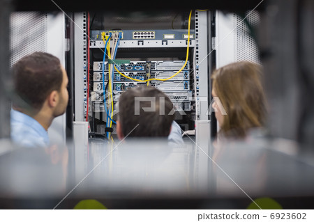 Technicians viewing a server Technicians viewing a server 6923602