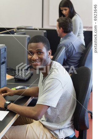 Happy student in computer class Happy student in computer class 6923646