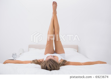 Woman stretching her legs Woman stretching her legs 6923674
