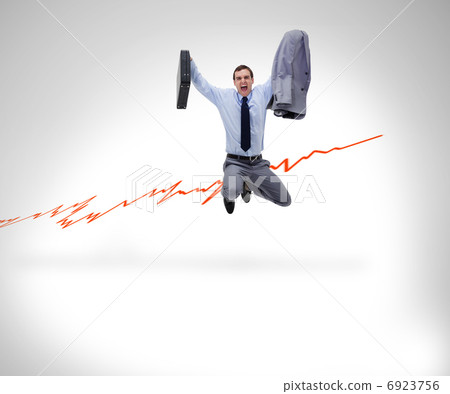 Successful businessman jumping against a background 6923756