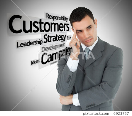 Businessman in grey suit thinking Businessman in grey suit thinking 6923757