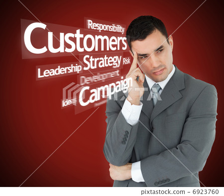 Serious businessman in grey suit thinking Serious businessman in grey suit thinking 6923760