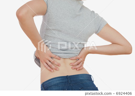 Rear view of woman with backache Rear view of woman with backache 6924406