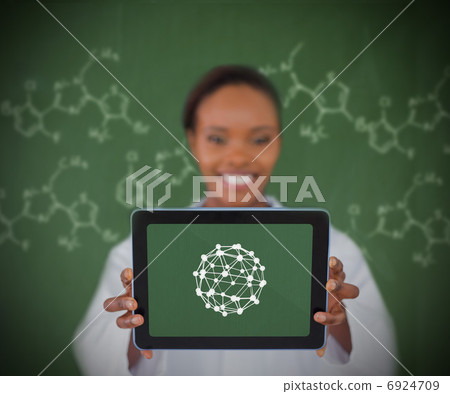 Smiling woman showing us sphere 6924709