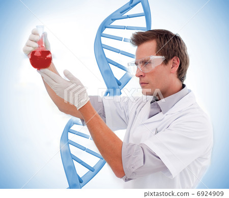 Scientist looking at beaker of blood 6924909