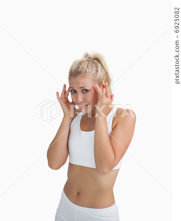 Young woman rubbing her temples Young woman rubbing her temples 6925082