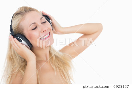 Relaxed woman enjoying music Relaxed woman enjoying music 6925137