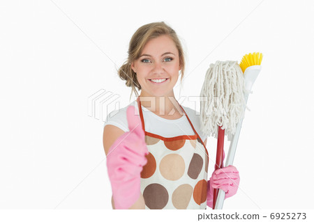 Portrait of maid with cleaning supplies gesturing thumbs up sign Portrait of maid with cleaning supplies gesturing thumbs up sign 6925273