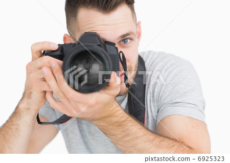 Close-up of male photographer with photographic camera 6925323