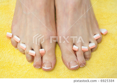Close-up of french pedicured feet Close-up of french pedicured feet 6925384