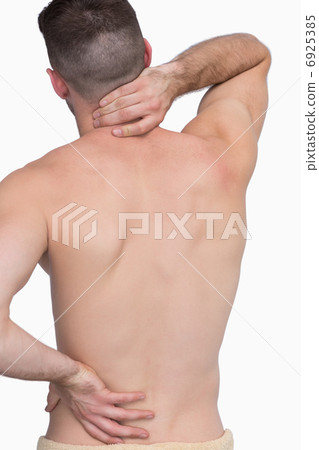 Rear view of shirtless man with neck pain over Rear view of shirtless man with neck pain over 6925385