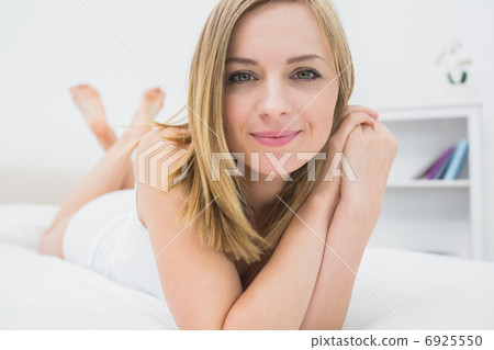 Portrait of beautiful relaxed woman in bed Portrait of beautiful relaxed woman in bed 6925550