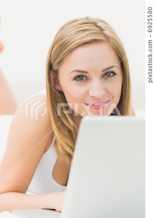 Portrait of beautiful happy woman using laptop Portrait of beautiful happy woman using laptop 6925580