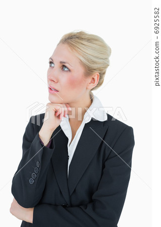 Thoughtful young business woman looking away 6925582