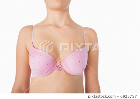 Midsection of woman in pink bra 6925757