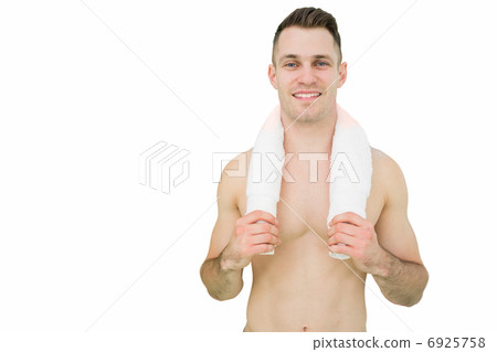 Portrait of happy man holding towel around neck 6925758