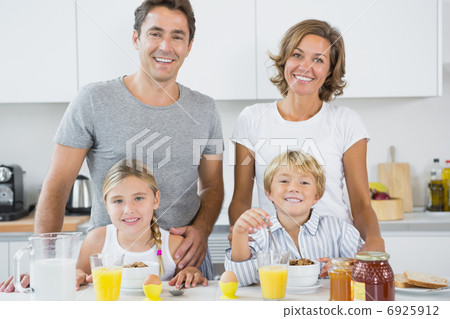 Happy family at breakfast Happy family at breakfast 6925912