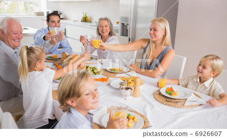 Happy family raising their glasses Happy family raising their glasses 6926607