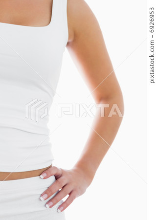 Midsection of fit woman in sportswear with hand on hip Midsection of fit woman in sportswear with hand on hip 6926953