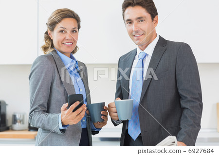 Power couple having coffee before work Power couple having coffee before work 6927684