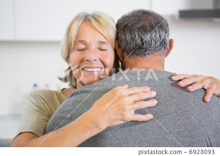 Joyful couple embracing 6928093