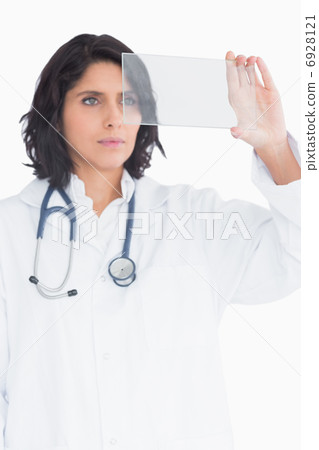 Doctor holding up virtual screen Doctor holding up virtual screen 6928121