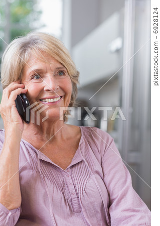 Smiling mature woman calling Smiling mature woman calling 6928124