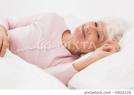 Happy woman in bed Happy woman in bed 6928126