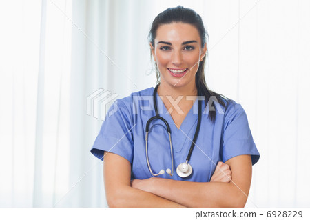 Happy nurse with arms crossed Happy nurse with arms crossed 6928229