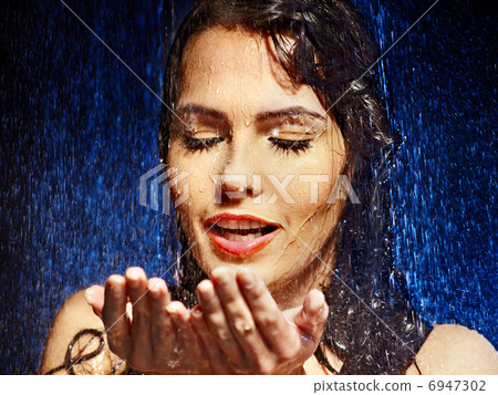 Wet woman face with water drop. 6947302