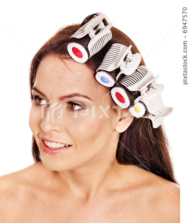 Woman wear hair curlers on head. Woman wear hair curlers on head. 6947570
