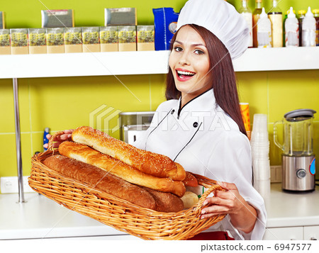 Female chef holding food. Female chef holding food. 6947577