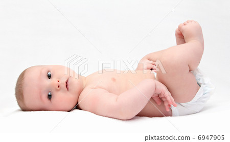 Beautiful baby lies on back 6947905