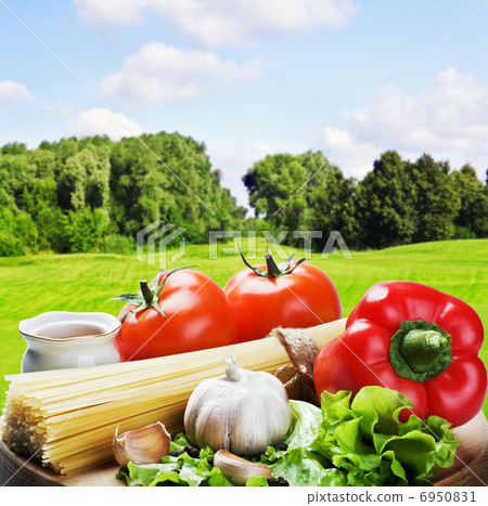 fresh vegetables and pasta on a wooden platter fresh vegetables and pasta on a wooden platter 6950831