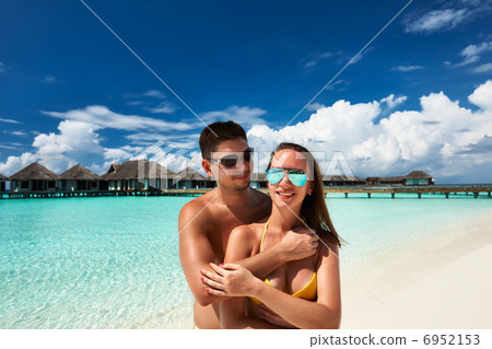 Couple on a beach at Maldives Couple on a beach at Maldives 6952153