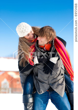 Couple having a winter walk 6955488