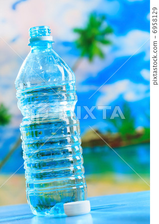 bottle of water on the beach bottle of water on the beach 6958129