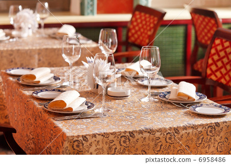 Wine glasses on a table Wine glasses on a table 6958486