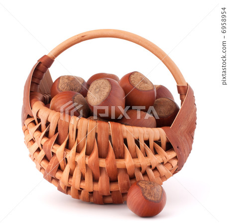 Hazelnuts in wicker basket 6958954