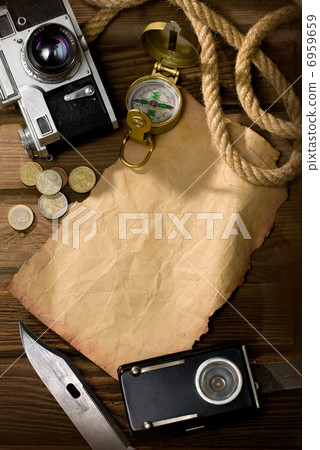 Compass on the old paper Compass on the old paper 6959659
