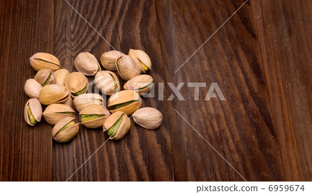 pistachios on  wooden  background 6959674