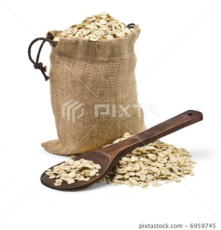 bag of oats and a wooden spoon bag of oats and a wooden spoon 6959745