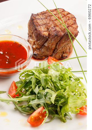 Grilled steak with sauce Grilled steak with sauce 6960272