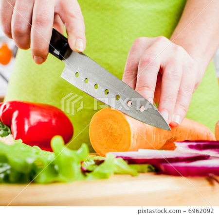 Woman's hands cutting vegetables Woman's hands cutting vegetables 6962092