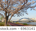 Blue bridge and cherry blossoms and cycling road 6963141