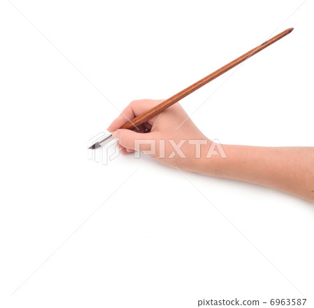 Hand holding brush 6963587
