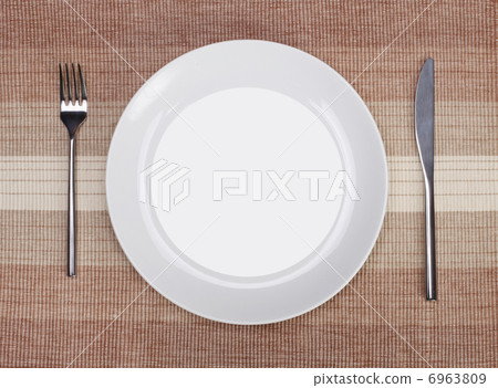 White empty plate with fork and knife White empty plate with fork and knife 6963809