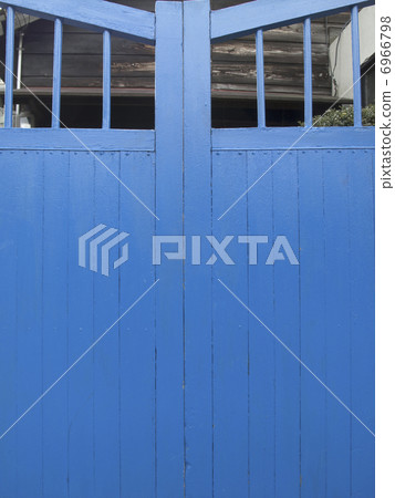 Gate door of residential building painted blue Gate door of residential building painted blue 6966798