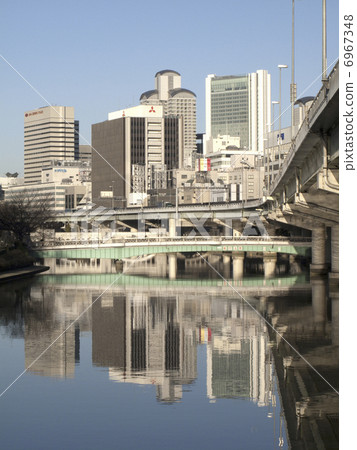 Buildings of Umeda reflected on the river 6967348